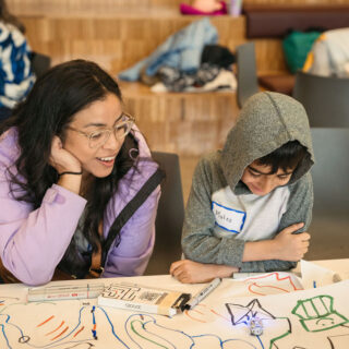 mother and son playing with ozobot
